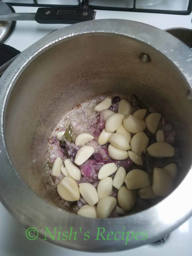 Add garlic for Poondu Kulambu