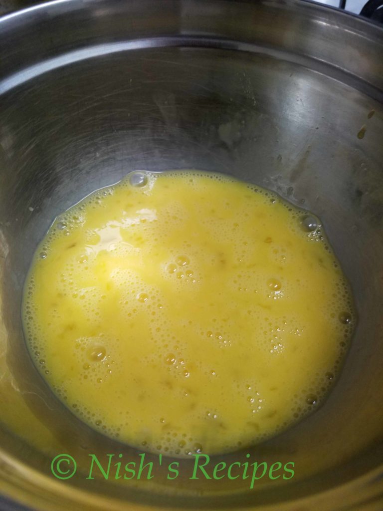 Beat egg for Egg Kuzhipaniyaram