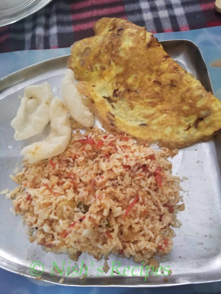 Serve Thakkali Thokku with rice