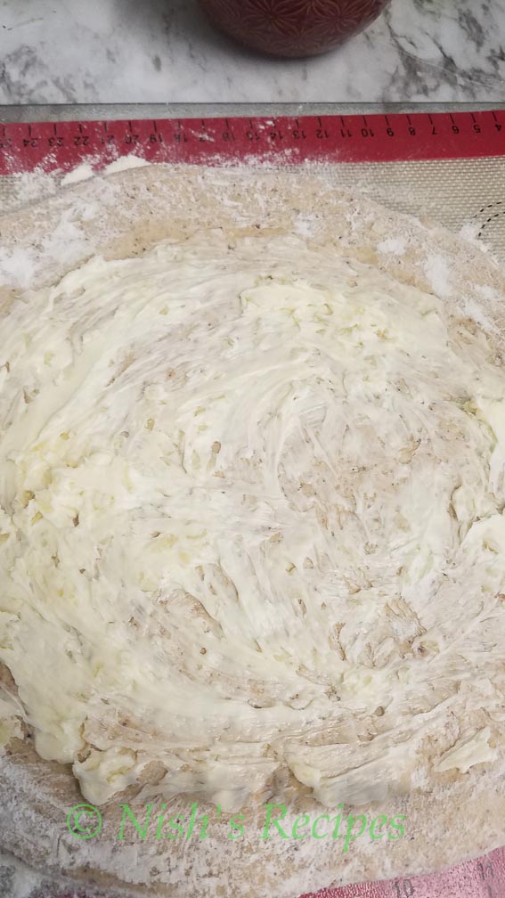 Spread butter garlic mix for Stuffed Garlic Bread
