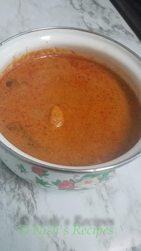 Serve Poondu Kulambu in a bowl