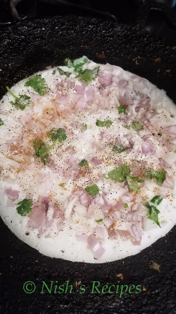 Sprinkle pepper for. Onion Uthappam